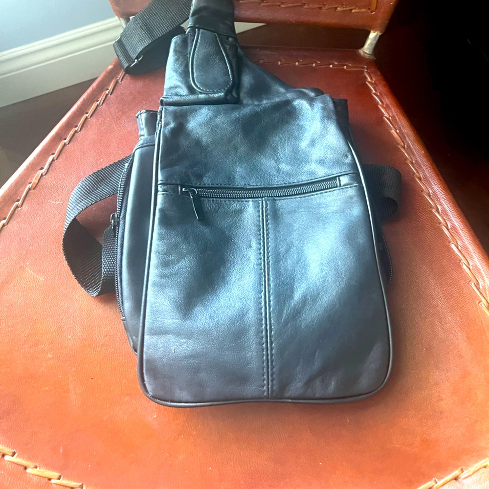 Genuine Leather cross body bag backpack with lots of compartments!